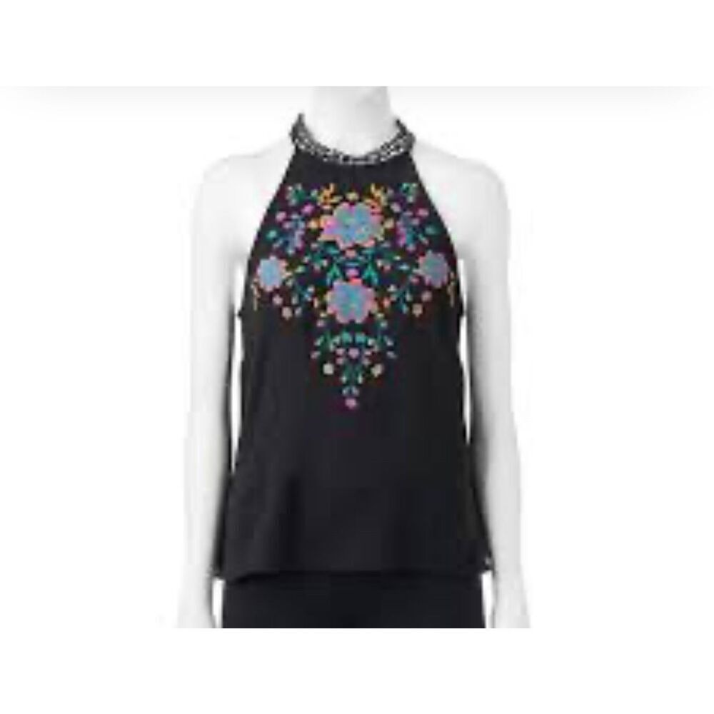 About a girl size M embroidered front lace collar racer back tank top.
